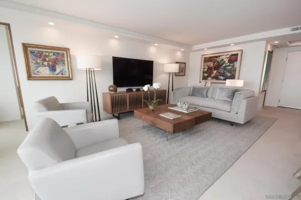 a living room with furniture and a flat screen tv