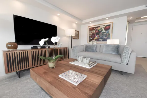 a living room with furniture and a large window