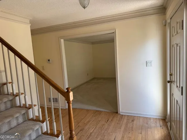 a view of entryway with wooden floor