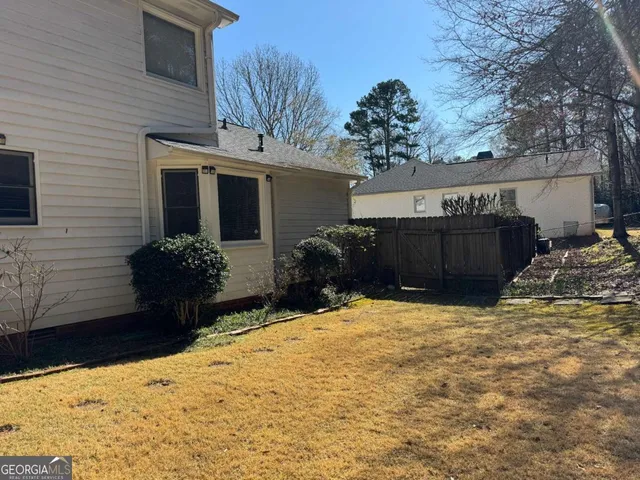 a view of a house with snow on the wall