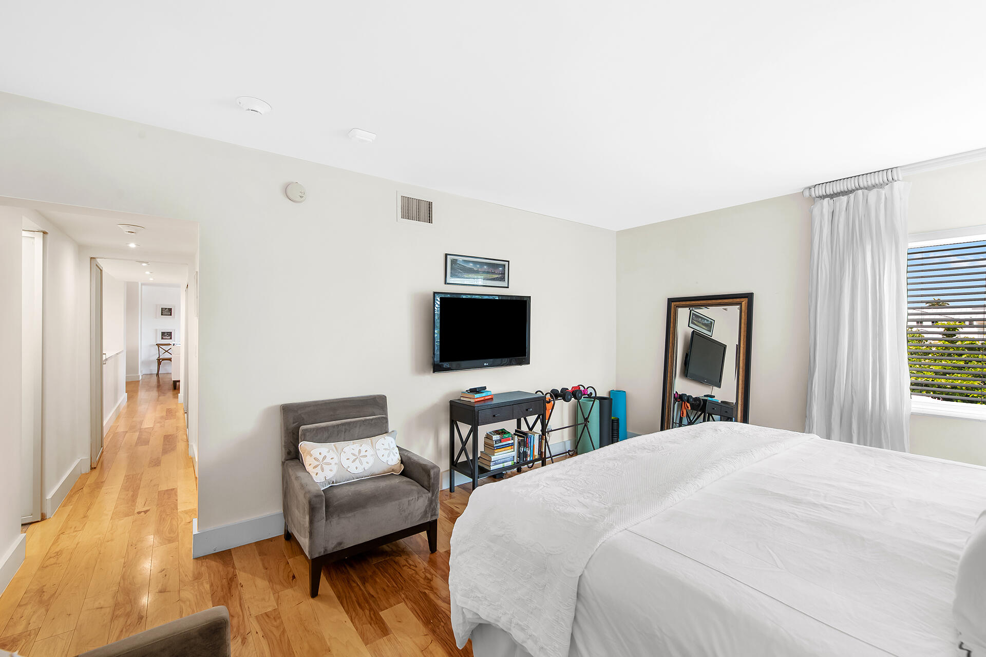 120 North Ocean Boulevard, Unit 202 Delray Beach, FL 33483 - Photo 11 of 32 a bedroom with a bed and a couch