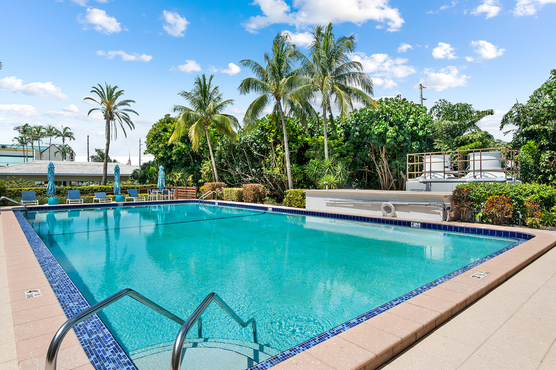 120 North Ocean Boulevard, Unit 202 Delray Beach, FL 33483 - Photo 28 of 32 a view of swimming pool with a garden and seating area