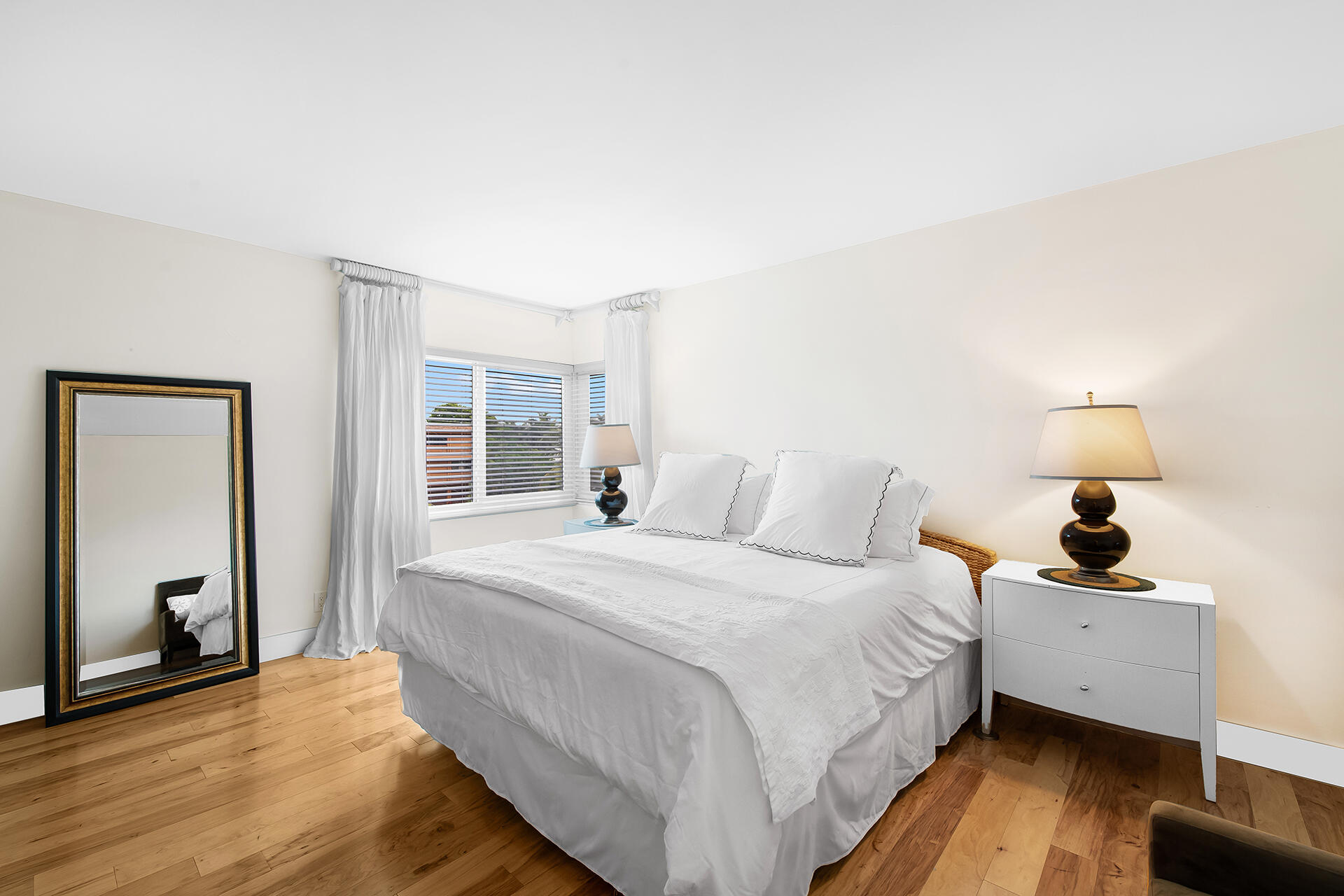 120 North Ocean Boulevard, Unit 202 Delray Beach, FL 33483 - Photo 10 of 32 a bedroom with a bed and a large window