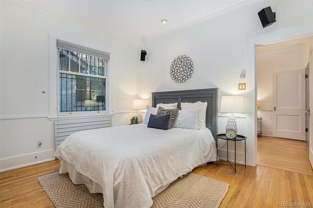 a bedroom with a bed and a night stand