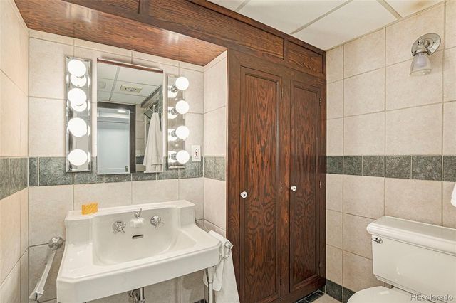 a bathroom with a bathtub a sink and a window