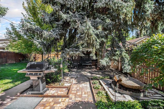 a view of a backyard with sitting area