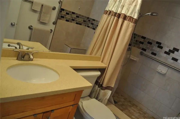 a bathroom with a sink and toilet