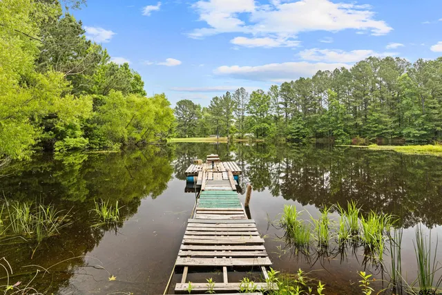 a balcony with next to a yard
