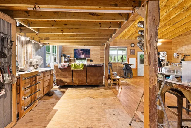 a view of a kitchen with furniture and a kitchen