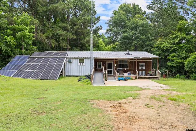 a front view of house with yard and seating area