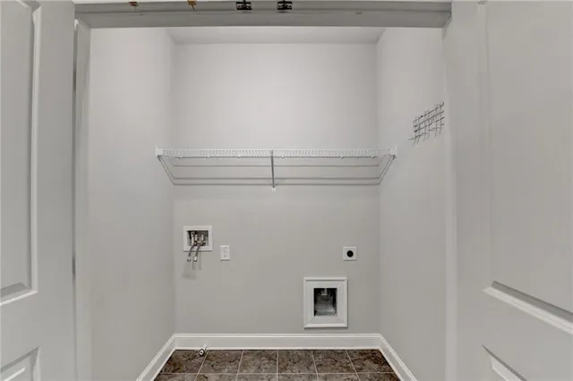 a view of a hallway with wooden floor and entryway