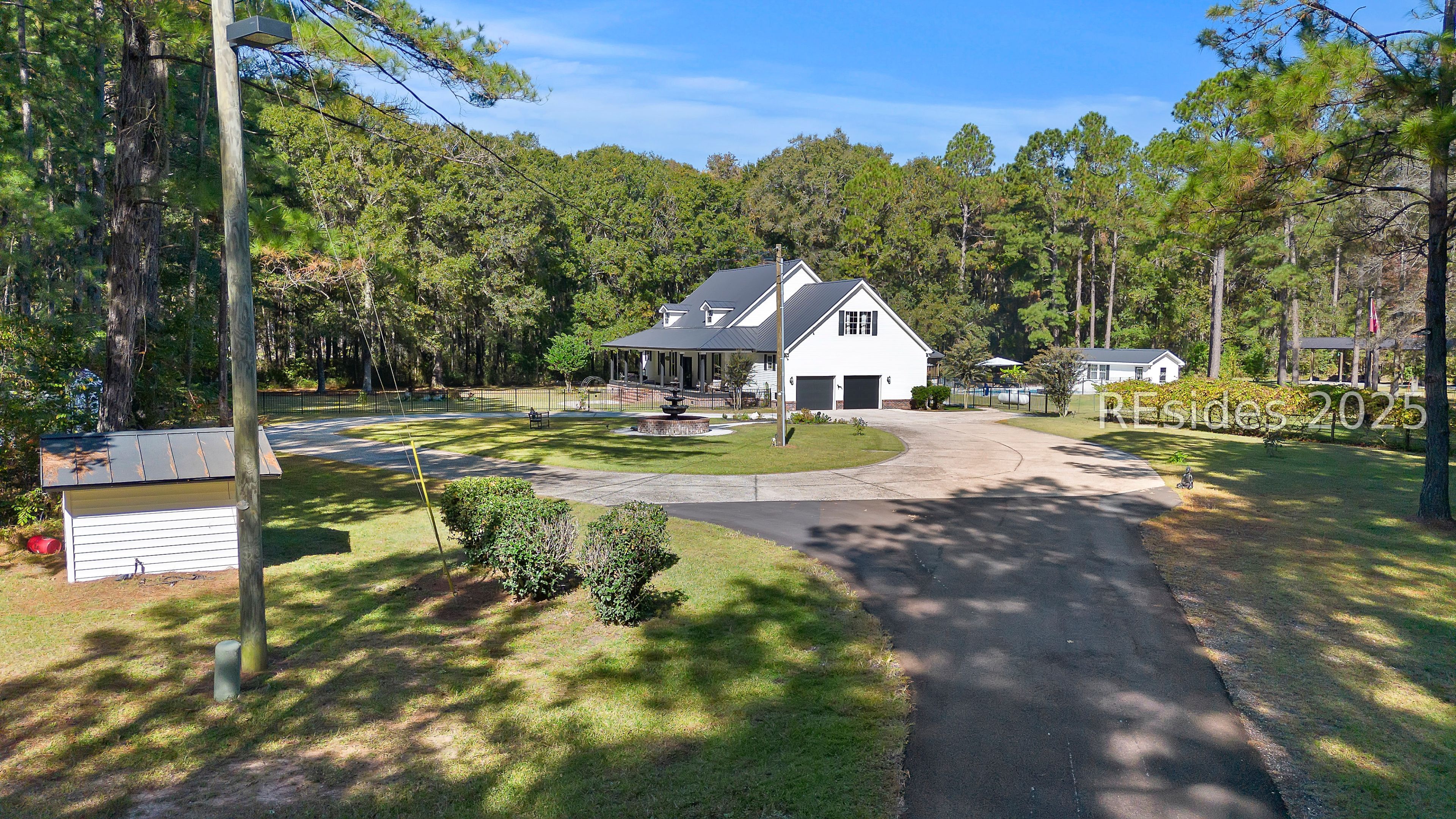 73 School Cut Road Hardeeville, SC 29927 - Photo 10 of 86 Driveway of home featuring water fountain