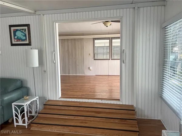 a view of a door and chair in a room