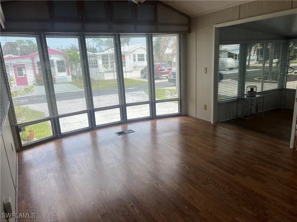 a view of an entryway with wooden floor
