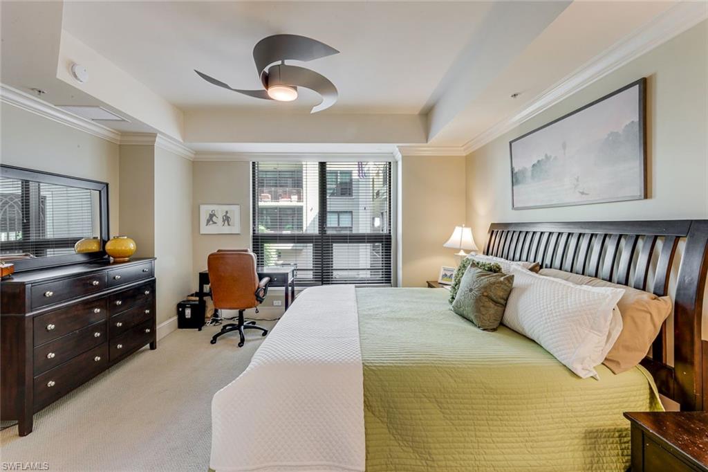 9123 Strada Place, Unit 7201 Naples, FL 34108 - Photo 13 of 50 a bedroom with a bed and furniture