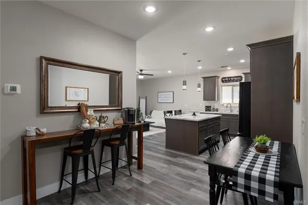 a large kitchen with a table and chairs