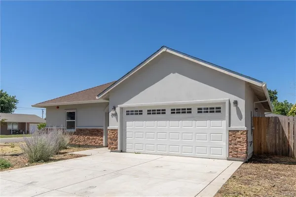 a front view of a house with a garage