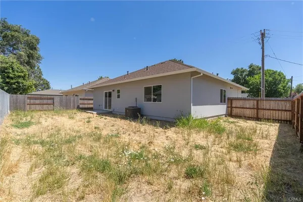a house view with a backyard space