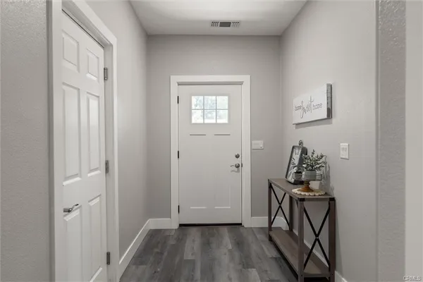 a workspace room with furniture and a window