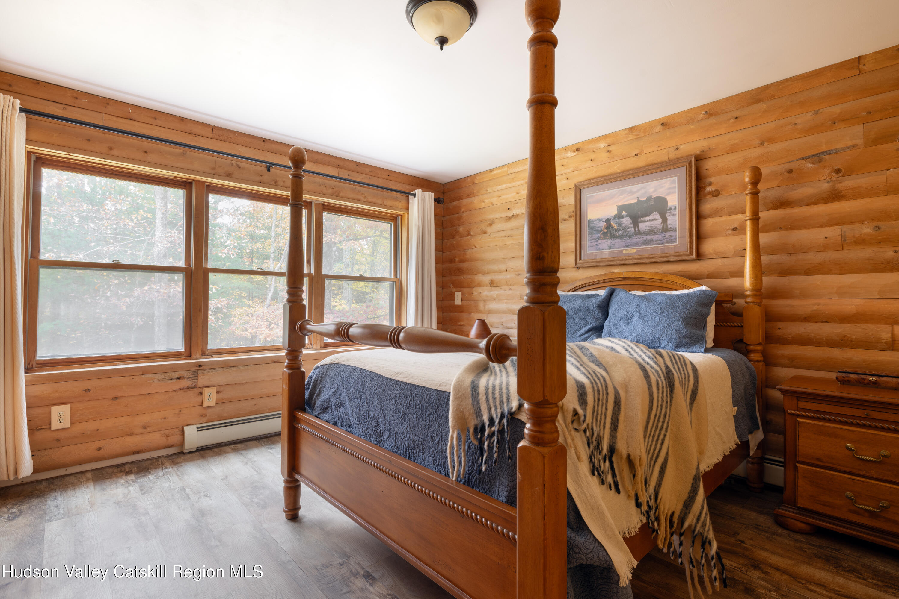 231 Decker Road Sparrowbush, NY 12780 - Photo 16 of 31 a spacious bedroom with two beds and large windows