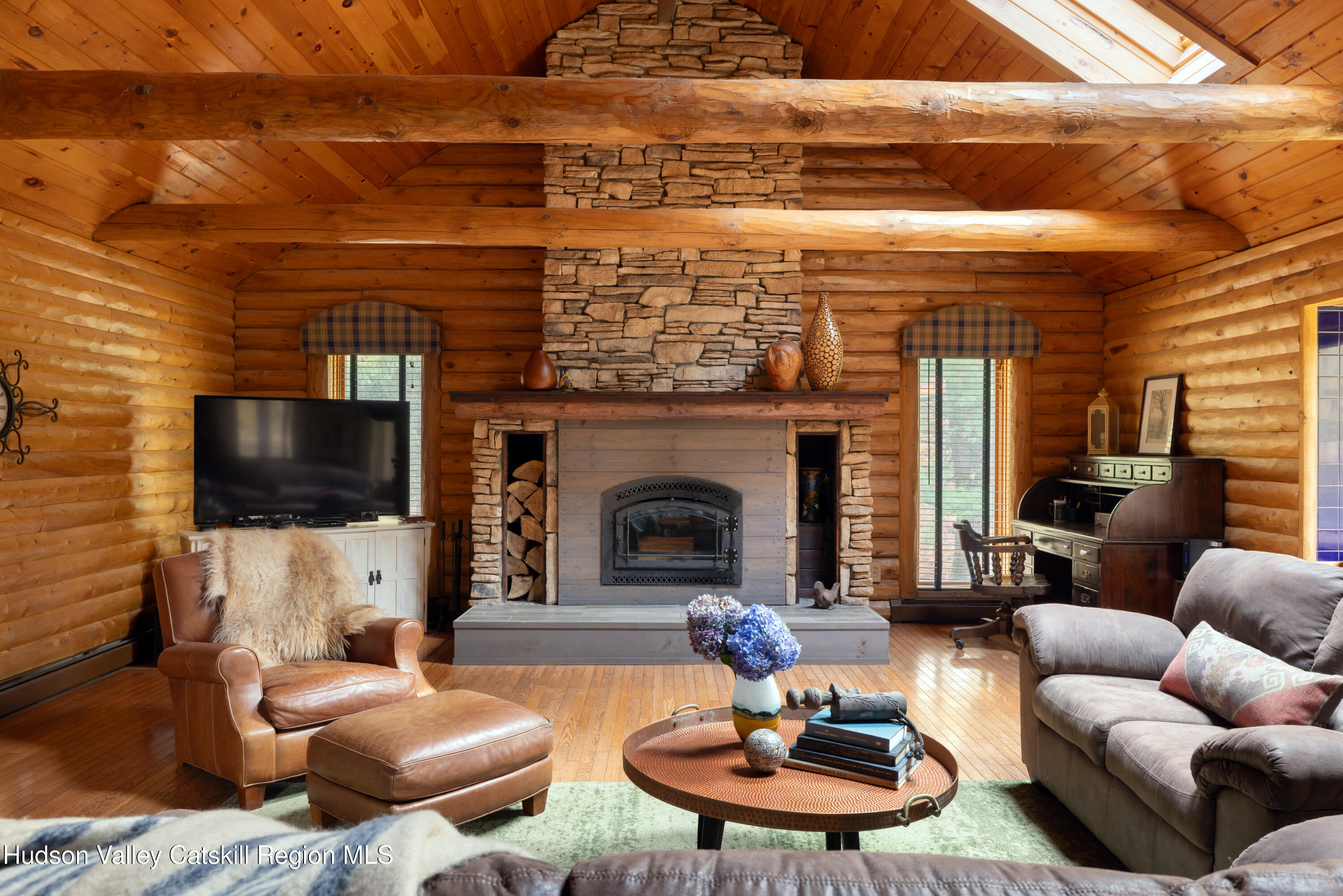 231 Decker Road Sparrowbush, NY 12780 - Photo 2 of 31 a living room with furniture and a fireplace