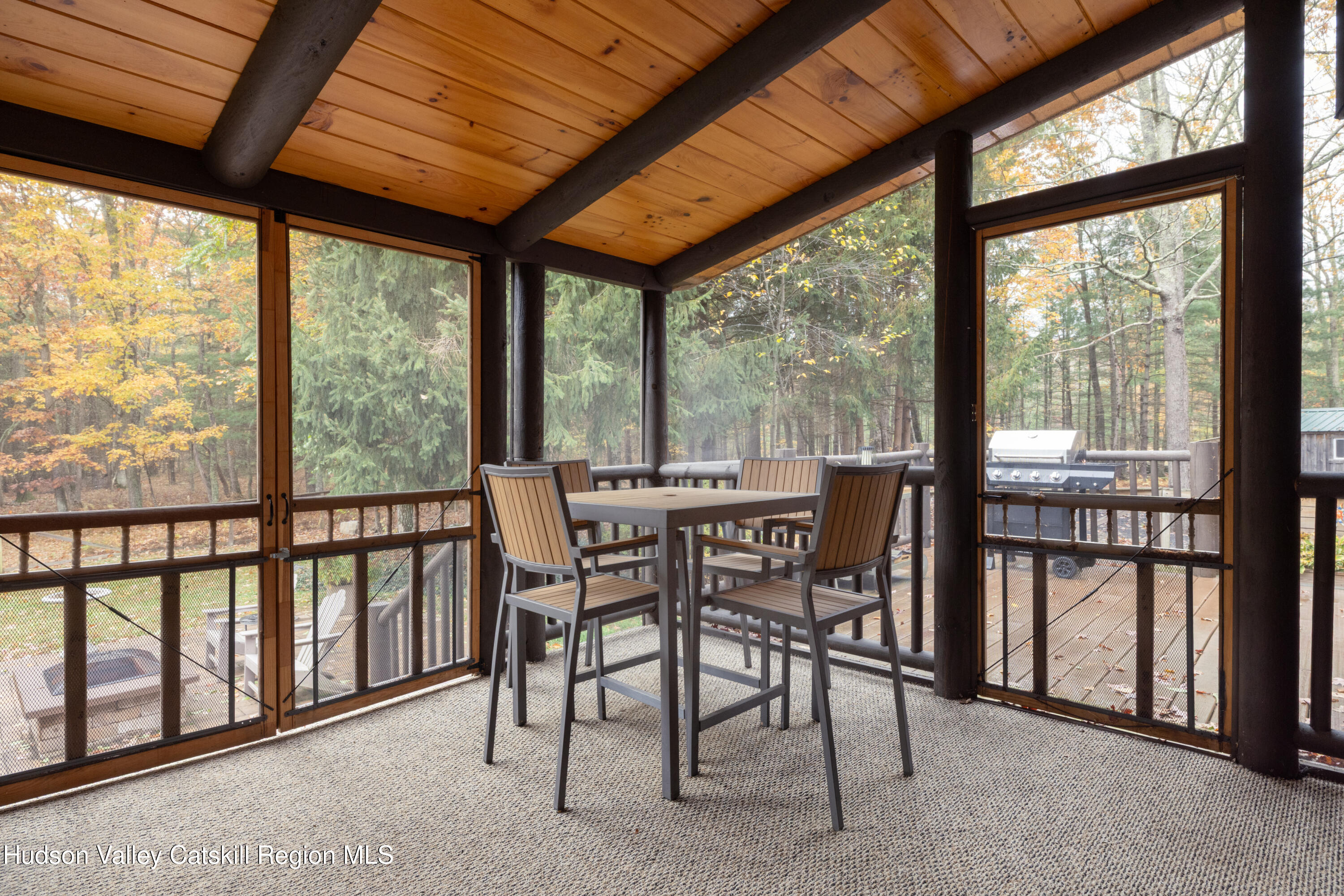 231 Decker Road Sparrowbush, NY 12780 - Photo 24 of 31 a dining room with furniture water view and a floor to ceiling window