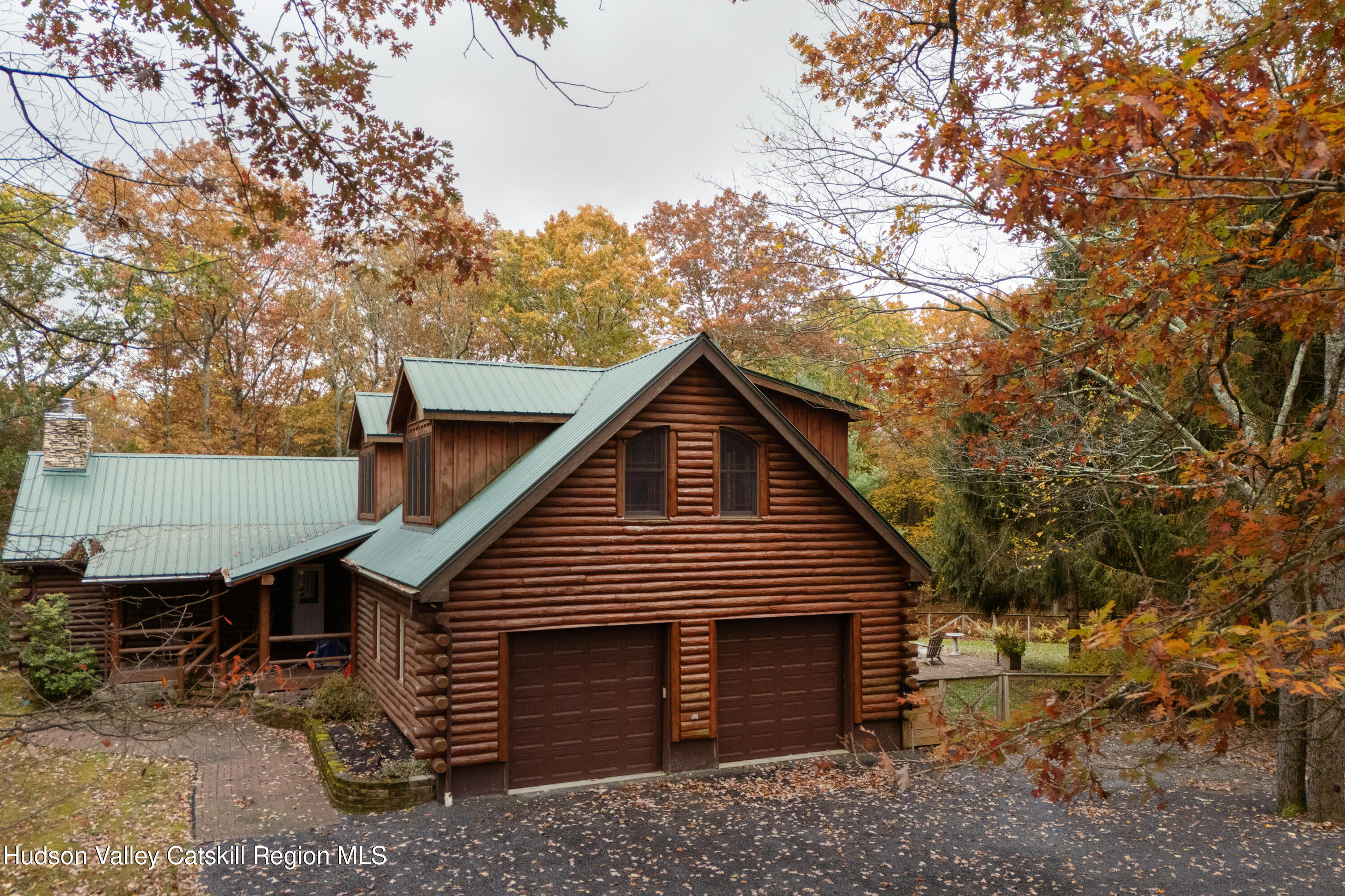 231 Decker Road Sparrowbush, NY 12780 - Photo 25 of 31 a front view of house with yard and trees in the background