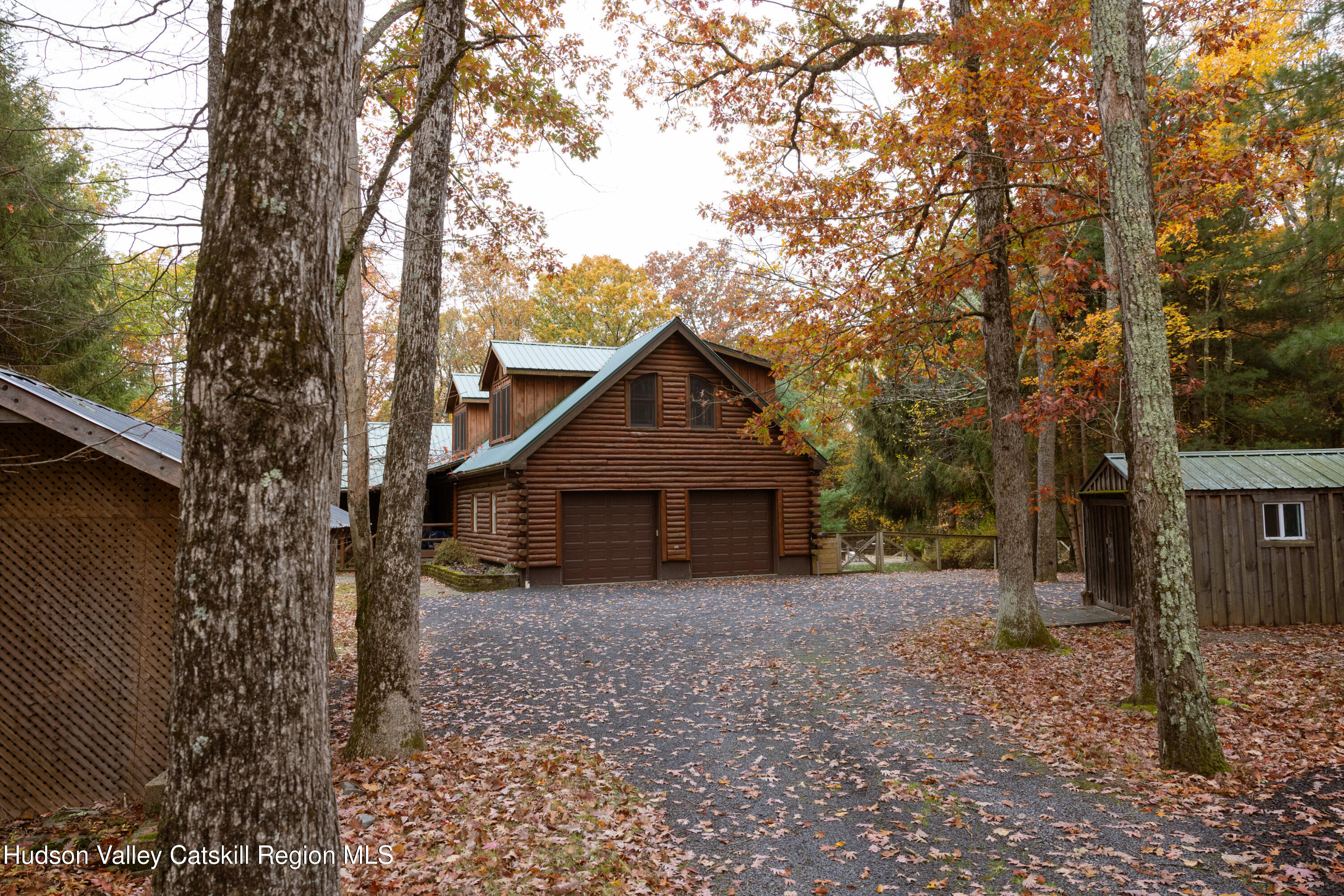231 Decker Road Sparrowbush, NY 12780 - Photo 29 of 31 a front view of a house with a yard and large tree