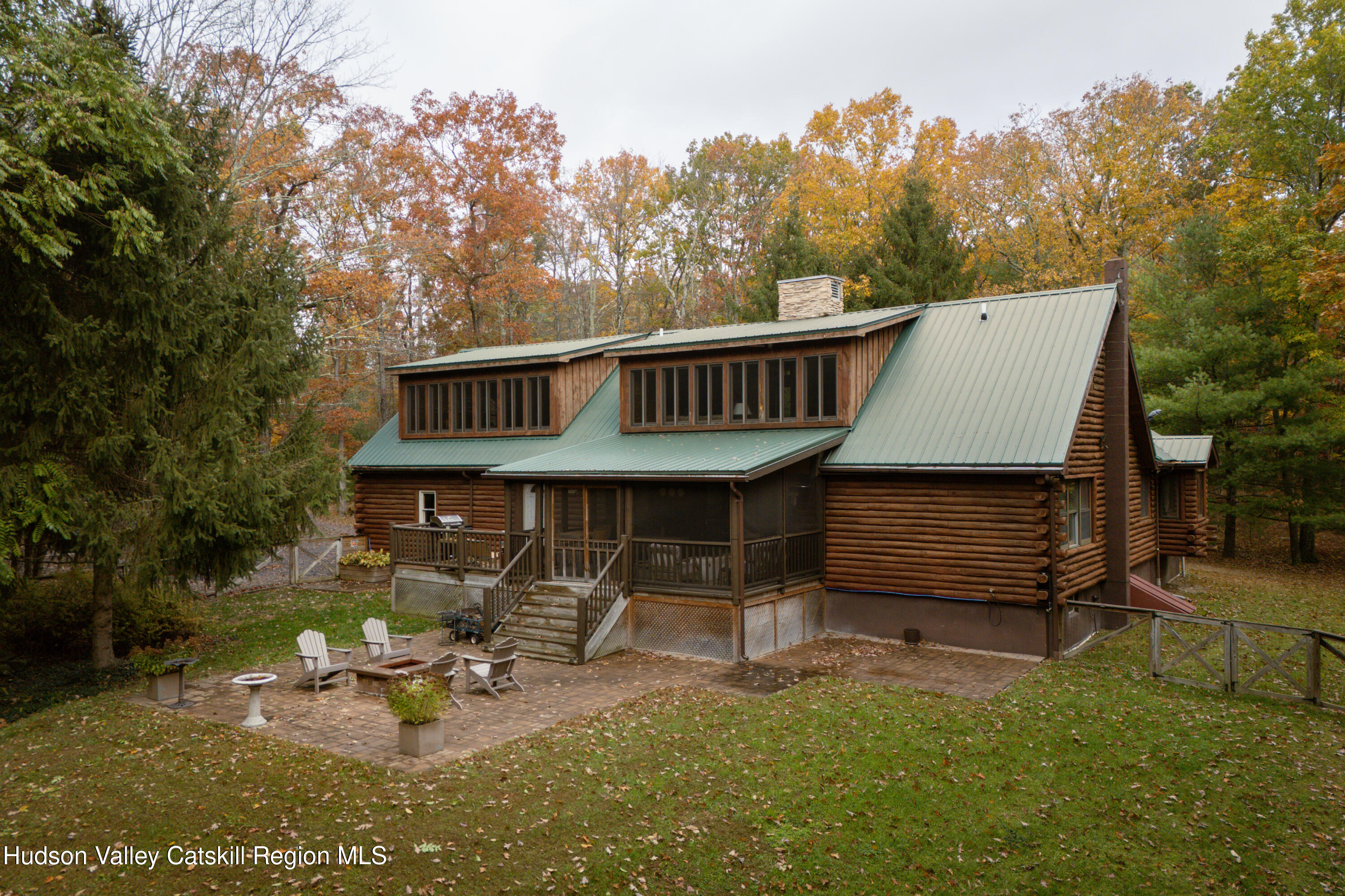 231 Decker Road Sparrowbush, NY 12780 - Photo 31 of 31 a view of a house with backyard porch and sitting area