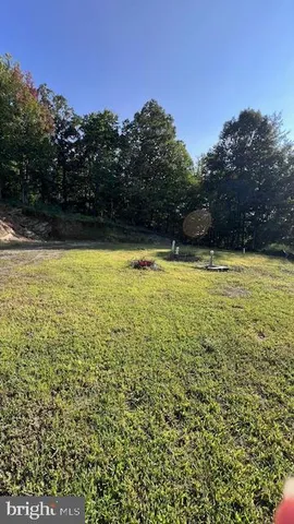 a view of a swimming pool with an outdoor space and seating area