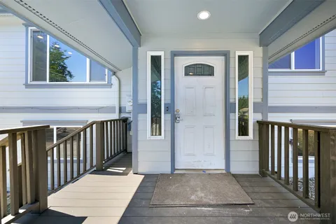 a view of a balcony with wooden floor