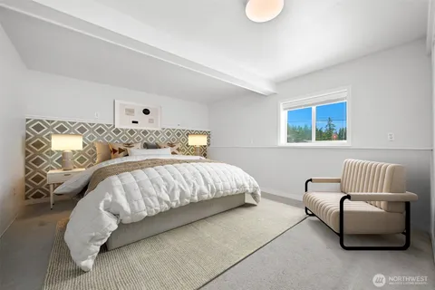 a bedroom with bed and window