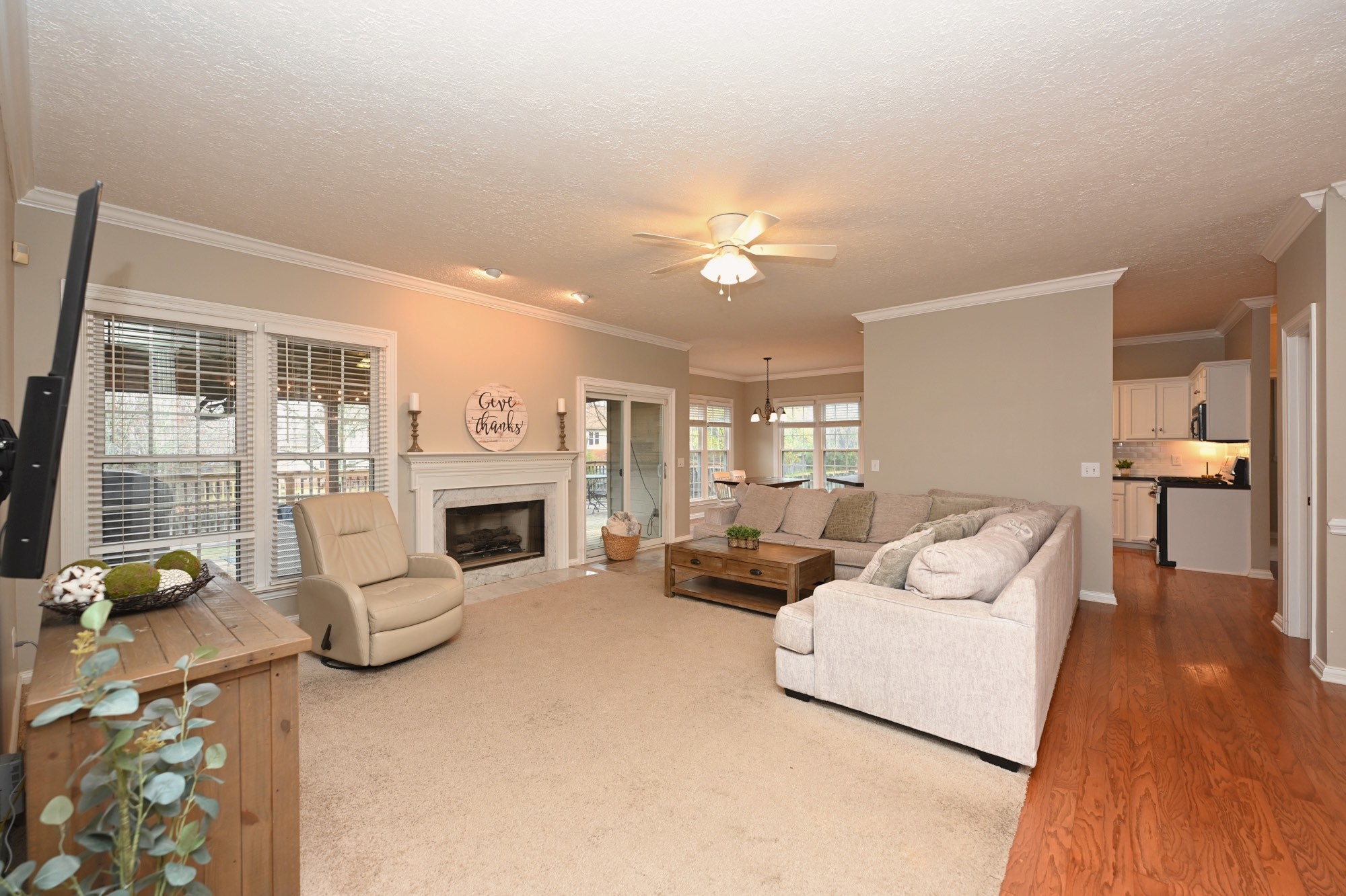 114 Wyncrest Way Hendersonville, TN 37075 - Photo 12 of 40 a living room with furniture a fireplace and a flat screen tv