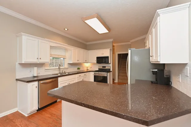 a spacious bedroom with a bed and window