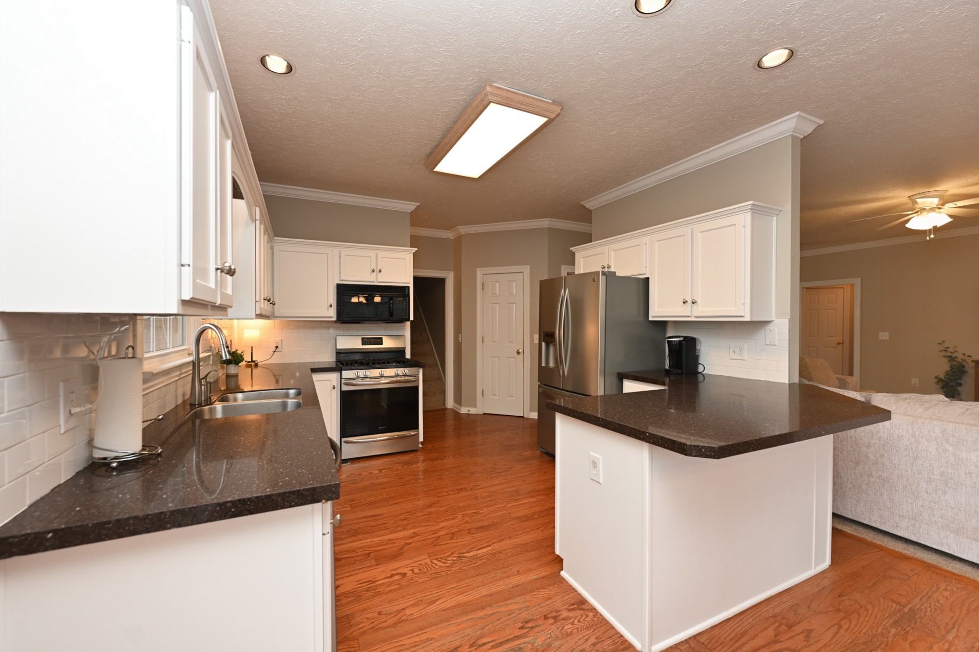 114 Wyncrest Way Hendersonville, TN 37075 - Photo 16 of 40 a kitchen with stainless steel appliances granite countertop a sink a stove and a refrigerator