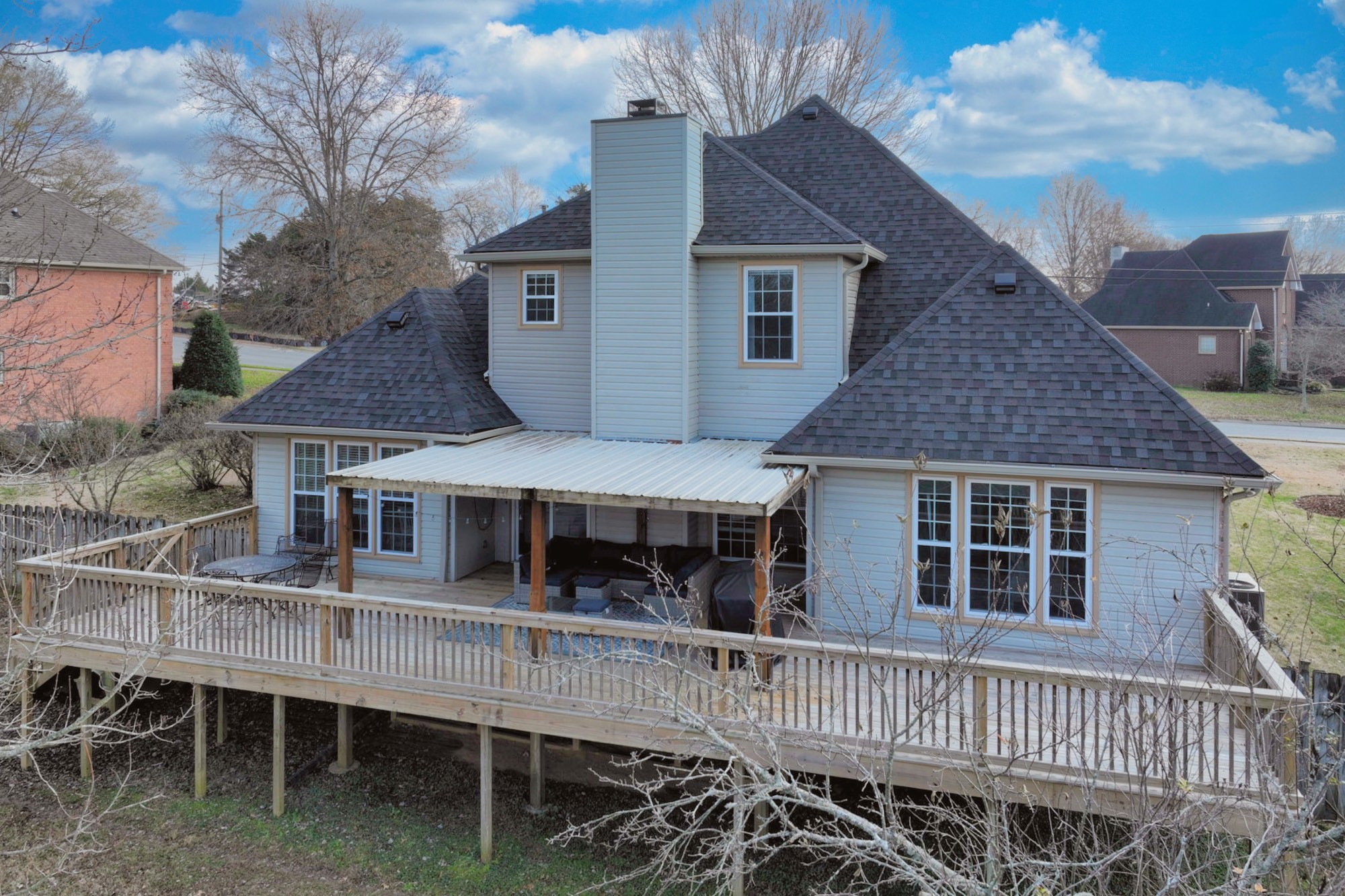 114 Wyncrest Way Hendersonville, TN 37075 - Photo 5 of 40 a view of a house with a wooden deck and furniture