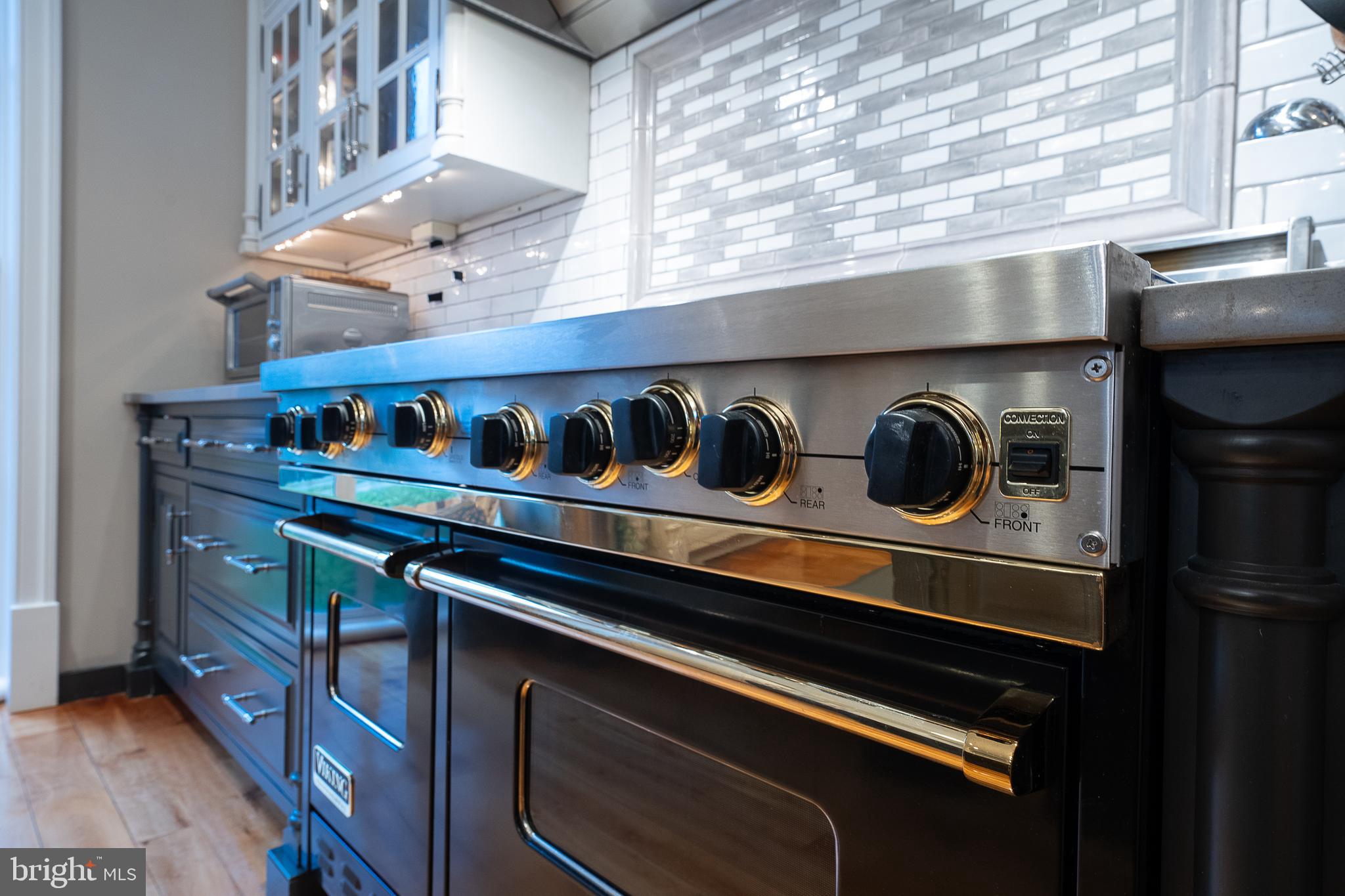 1122 Brynlawn Road Villanova, PA 19085 - Photo 26 of 55 Viking range has hood with fan and lighting