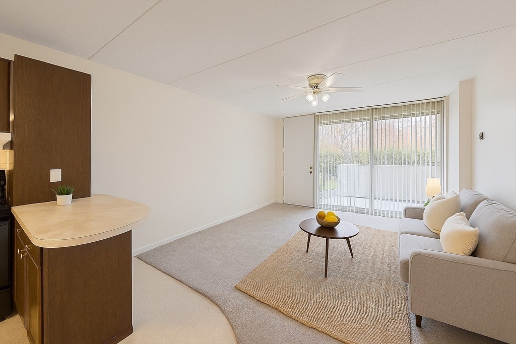 a living room with furniture and white walls