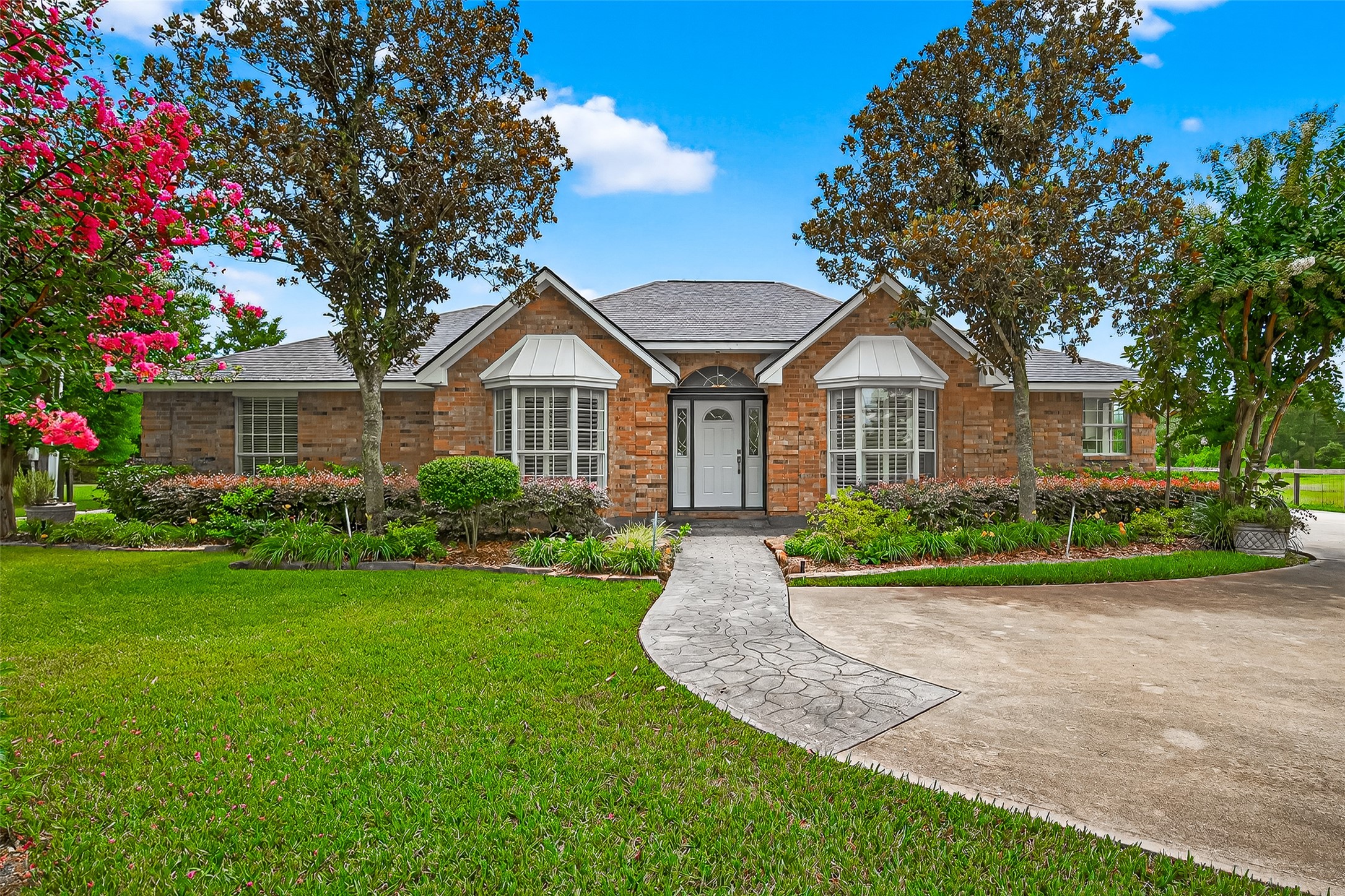 a front view of a house with garden