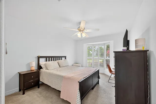 a bed room with a bed and a window