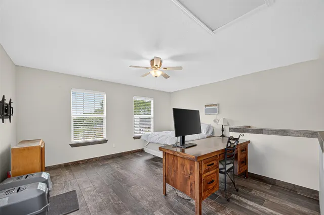 a workspace with furniture and a window