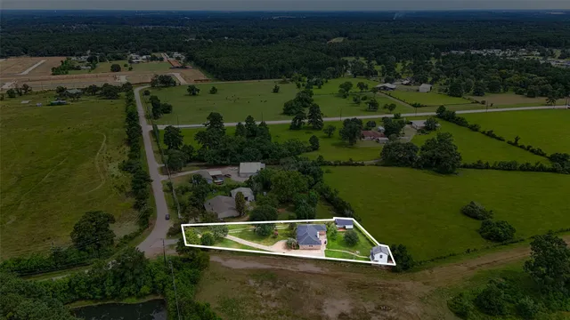 an aerial view of boat and residential houses with outdoor space