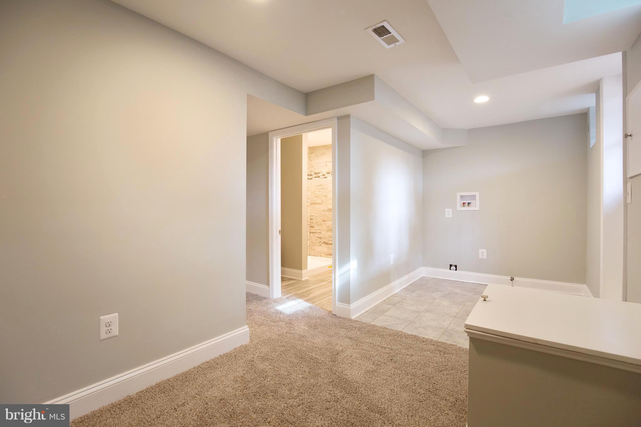 6643 Frederick Road Catonsville, MD 21228 - Photo 27 of 30 Laundry, exterior doorway, hall to 2nd bath
