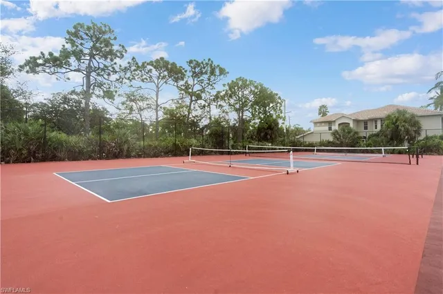 a lake view with a sitting space and a large pool