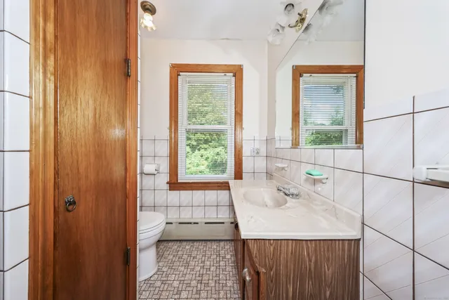 a bathroom with a sink a vanity and a shower