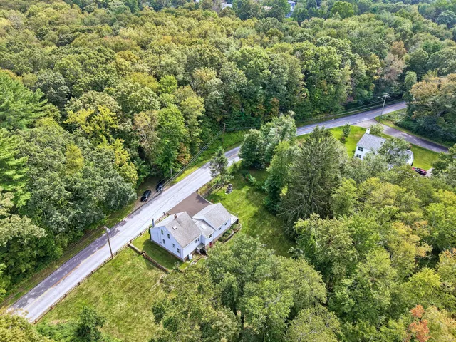 a view of a yard with an outdoor seating