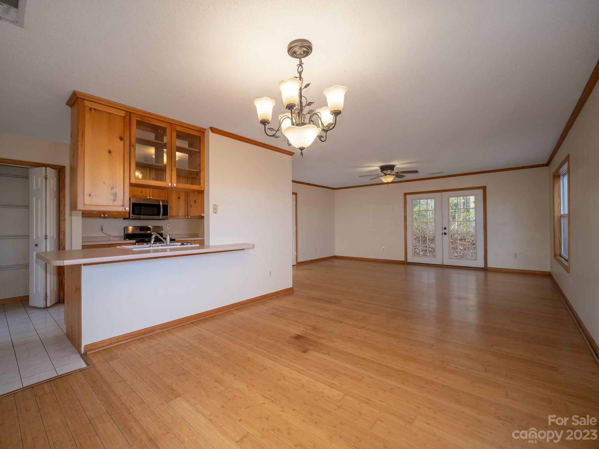 430 Jeep Road Brevard, NC 28712 - Photo 15 of 45 a view of an empty room with window and wooden floor