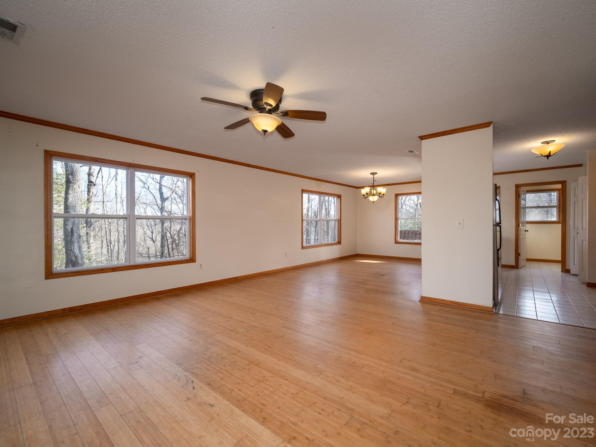430 Jeep Road Brevard, NC 28712 - Photo 17 of 45 a view of an empty room with a window and wooden floor