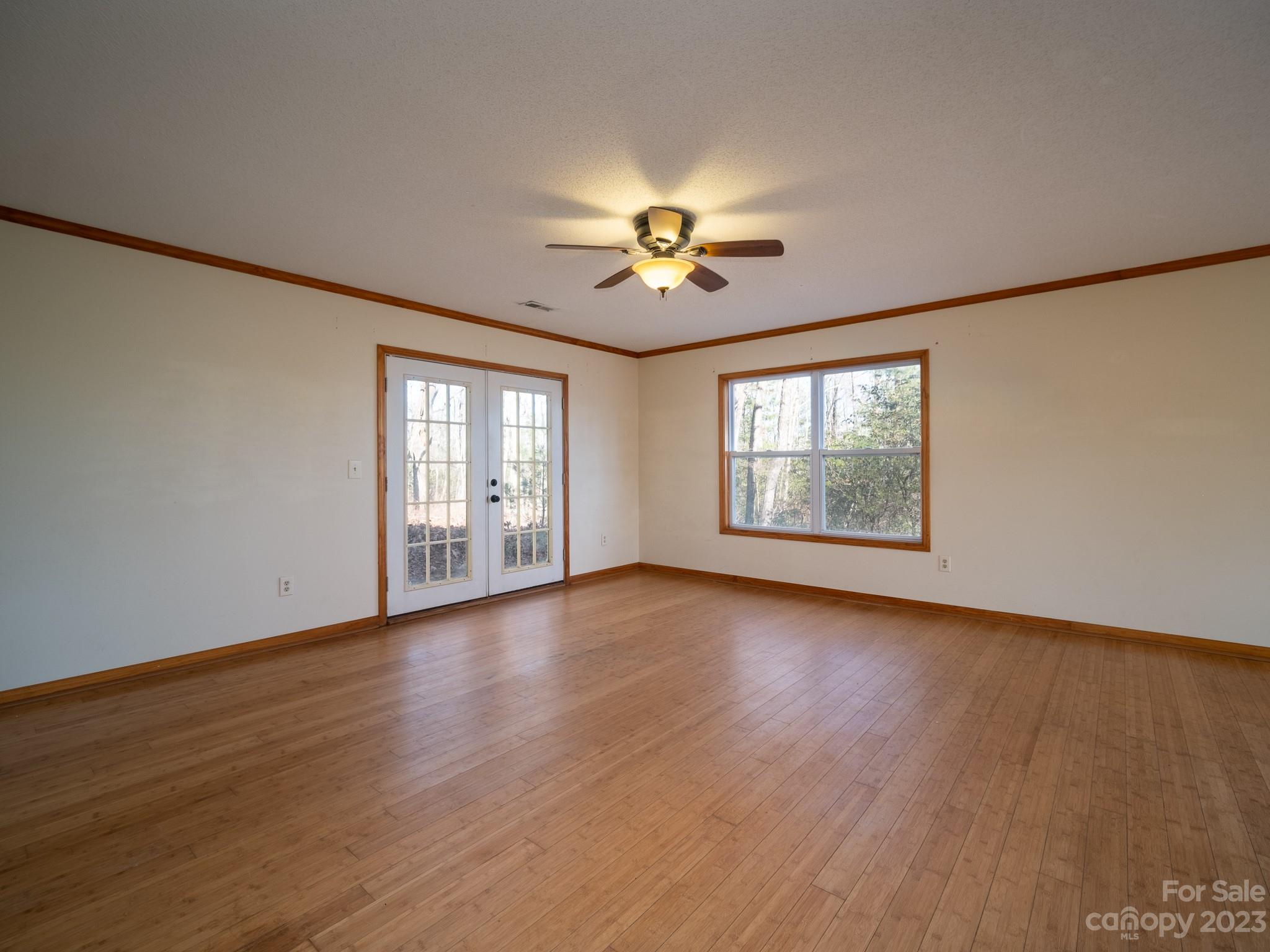 430 Jeep Road Brevard, NC 28712 - Photo 18 of 45 a view of an empty room with a window and wooden floor