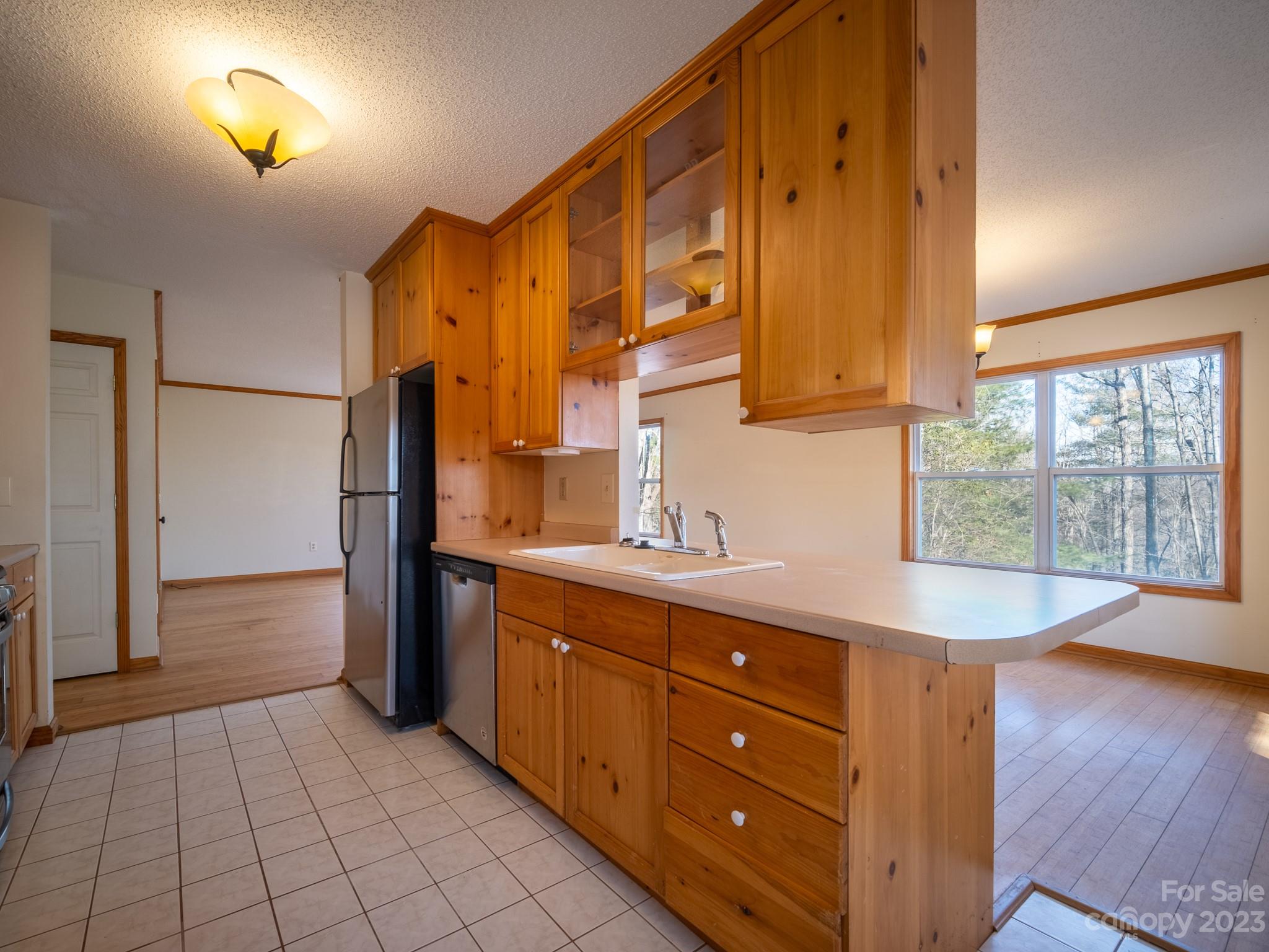 430 Jeep Road Brevard, NC 28712 - Photo 22 of 45 a kitchen with sink cabinets and wooden floor